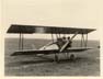 Single seater biplane on the ground