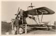 Men working on a biplane